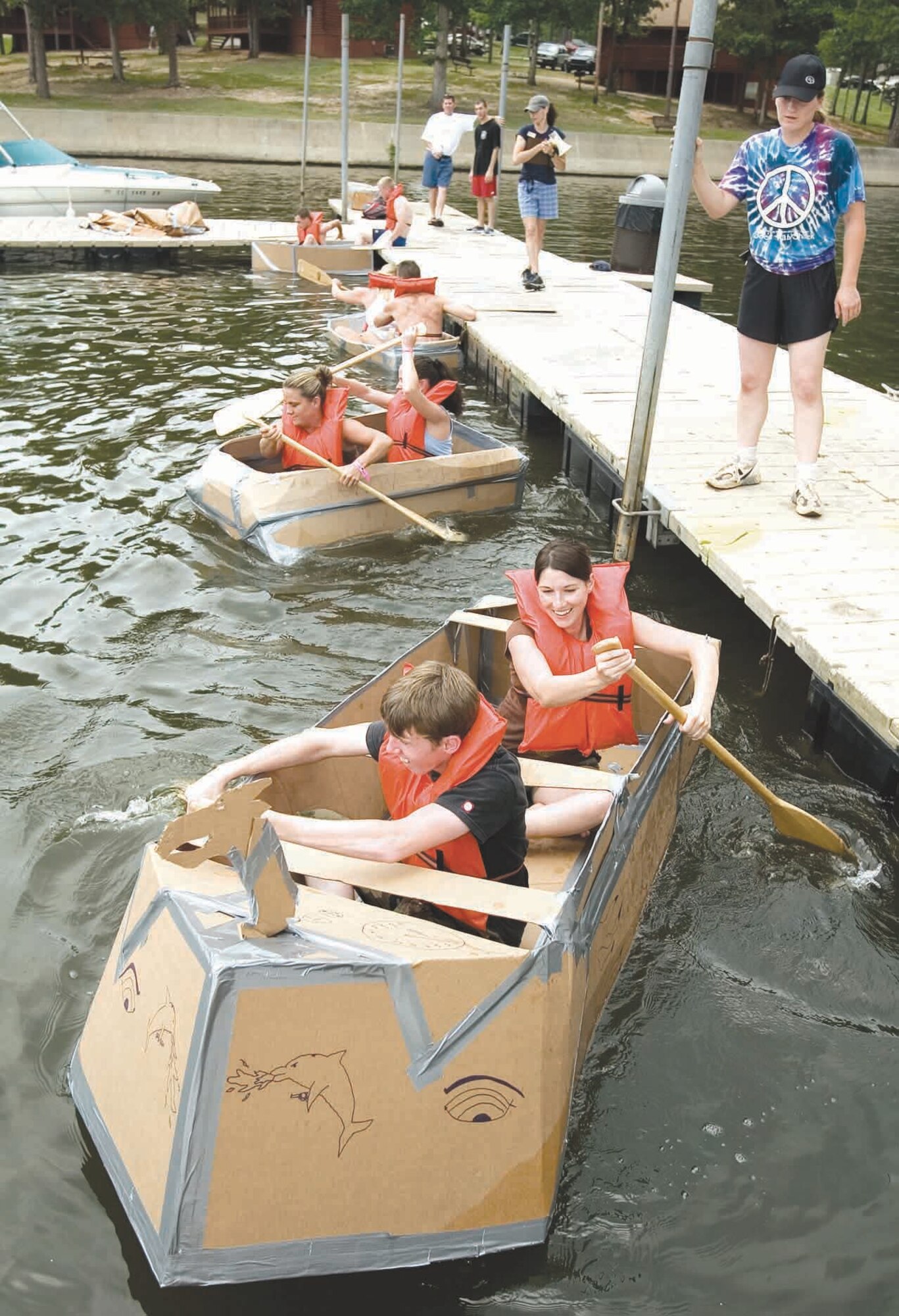 Airman from various Shaw squadrons paddled their way through three cardboard boat race heats July 14.   (U.S. Air Force photo/Senior Airman Christopher Lynch)