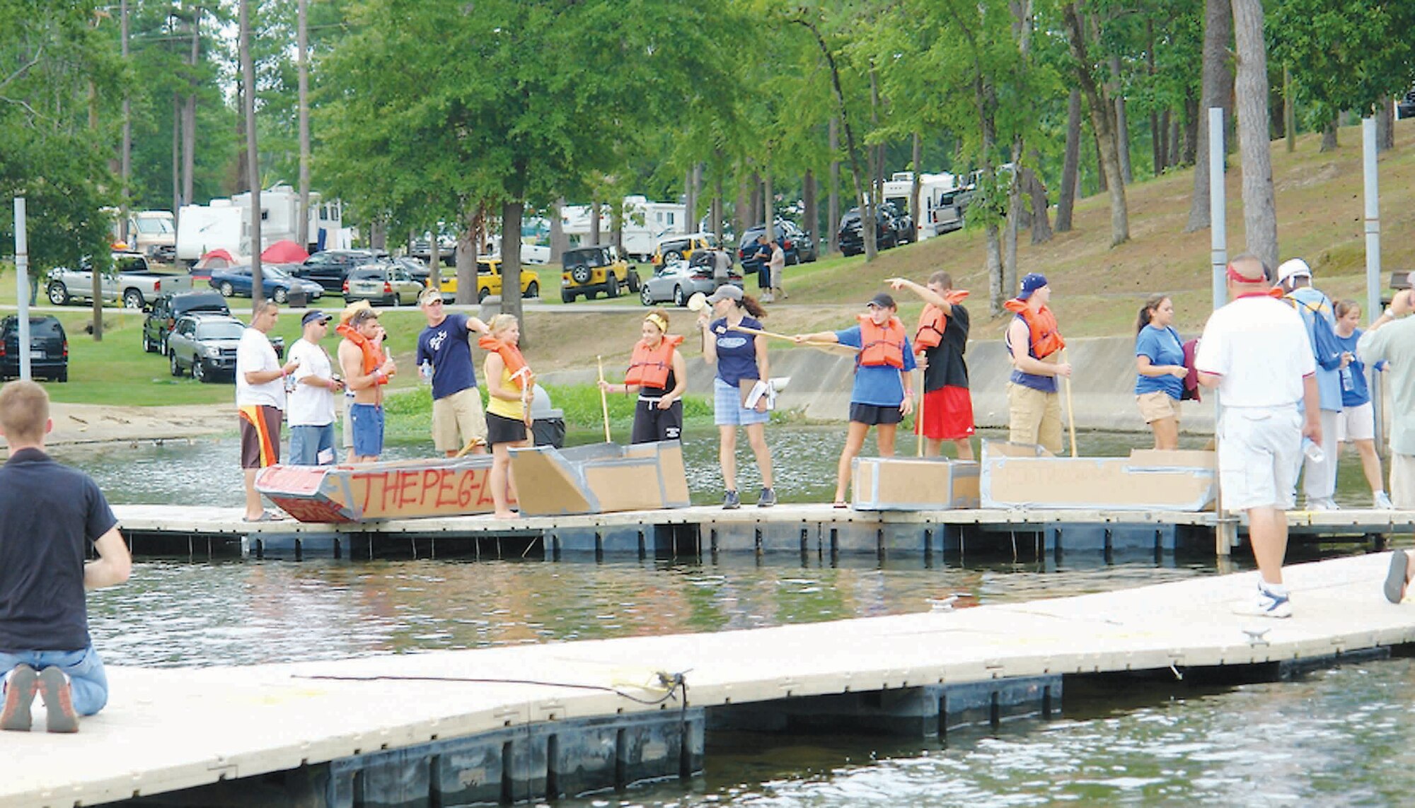 Cardboard boat race participants discuss last minute strategies prior to the race July 14.  (U.S. Air Force photo/Bob Turner)
