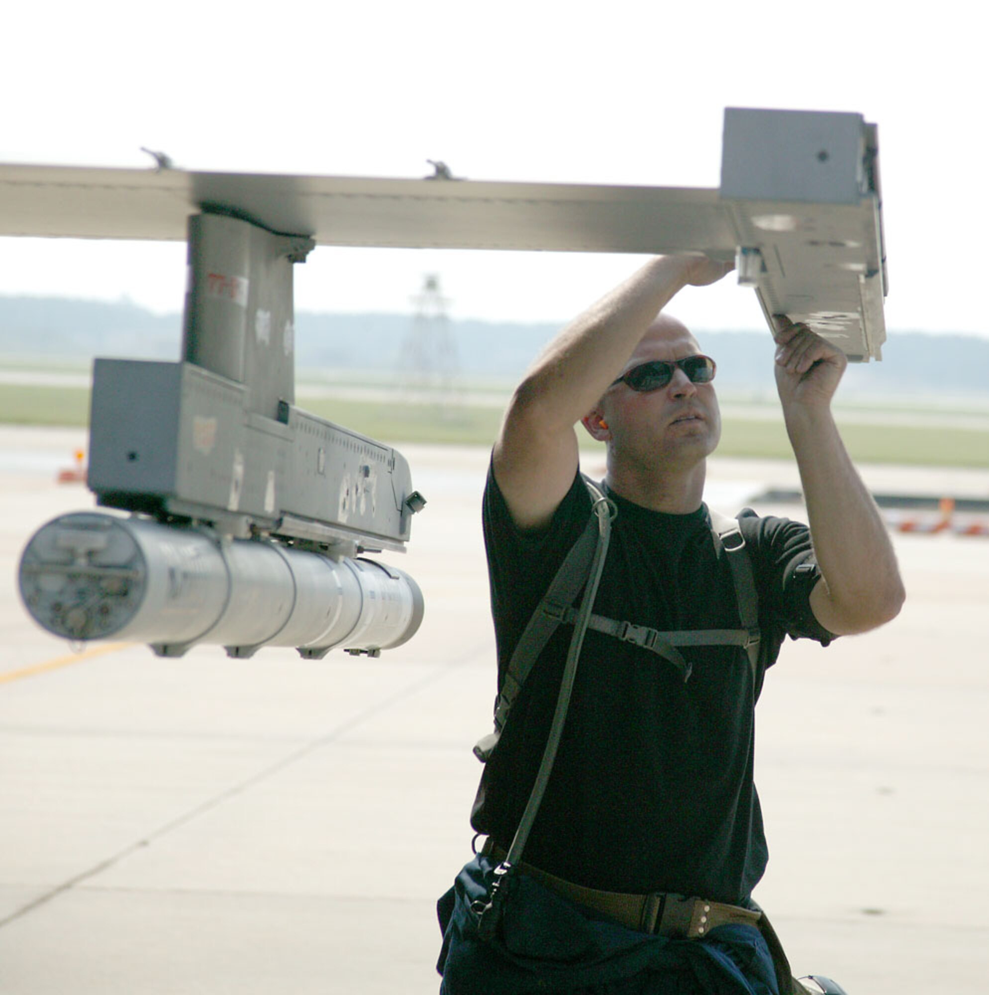 Staff Sgt. Jason Leader, 77th Aircraft Maintenance Unit weapons team chief, inspects a Gambler F-16 prior to take off Monday at Shaw. The jet flew in support of Operation Iron Thunder.  (U.S. Air Force Photo/Senior Airman John Gordinier)