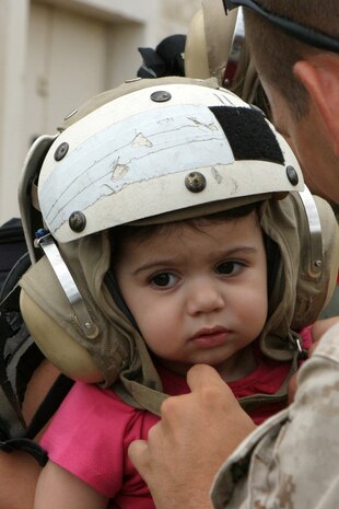 A U.S. Marine from the 24th Marine Expeditionary Unit assists an American baby as she prepares to depart the American Embassy in Beirut, Lebanon, July 21, 2006. At the request of the U.S. Ambassador to Lebanon and at the direction of the Secretary of Defense, the United States Central Command and elements of Task Force 59 are assisting with the departure of U.S. citizens from Lebanon. DoD photo by Cpl. Jeffrey A. Cosola, U.S. Marine Corps. (Released)