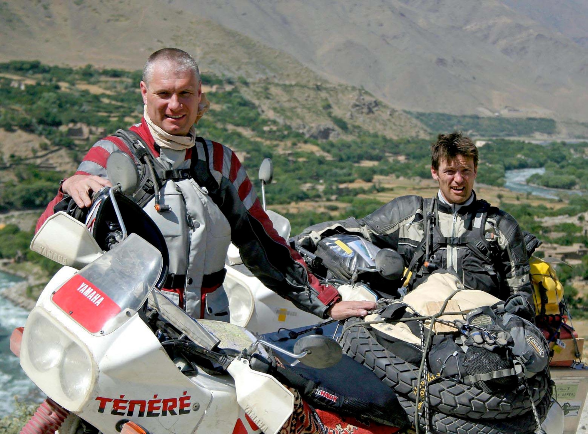 British Army Lieutenant Colonels Felix Gedney (left) and Gary Bateman are riding from Kabul, Afghanistan to Monchengladbach, Germany to raise awareness and money for the Sandy Gall Afghanistan Appeal charity. The organization provides artificial limbs and mobility aids for Afghan patients, primarily landmine victims. The pair visited the Panjshir Provincial Reconstruction Team June 30 on the first leg of their journey. (Courtesy photo by Air Force Tech. Sgt. John Cumper).