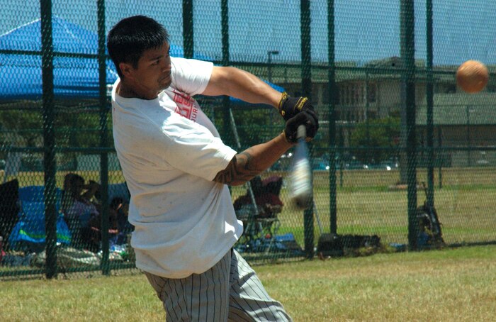 Cecil Hale's swing hits one of his eight home runs, during a Home Derby held July 21 at Annex Field, here. Hale, the smallest of the 18 participants in the contest, took first place.