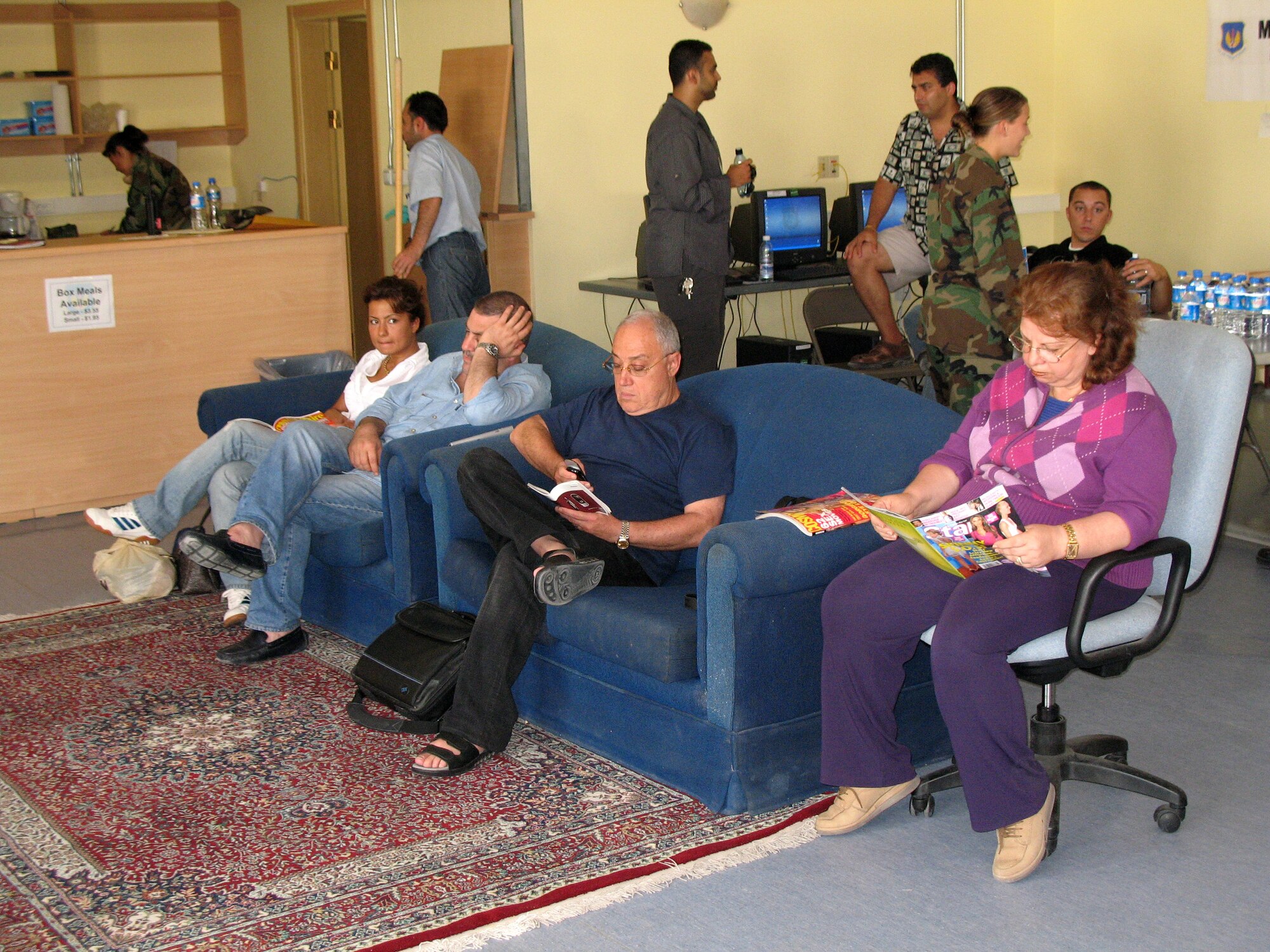 American citizens who departed Lebanon read and watch television during their stay at the Patriot Village at Incirlik Air Base, Turkey, on July 22. The base has provided telephones, Internet service, television, beds and showers to the displaced American citizens while they wait to travel to the United States. (U.S. Air Force photo/Master Sgt. Bob Herron) 
