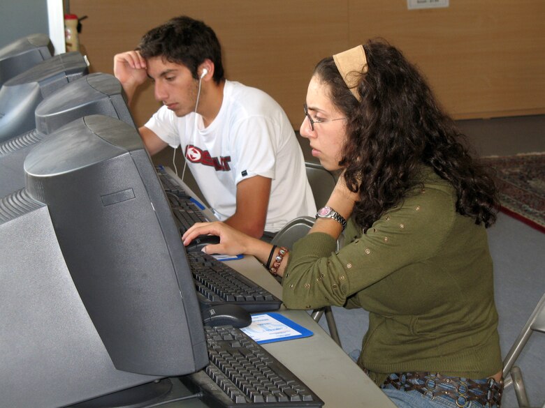 American citizens who departed Lebanon surf the Web at the Patriot Village Community Center at Incirlik Air Base, Turkey, on July 22. The base has provided telephones, Internet service, television and other amenities to the displaced Americans while they wait to travel back to the United States. (U.S. Air Force photo/Master Sgt. Bob Herron) 
