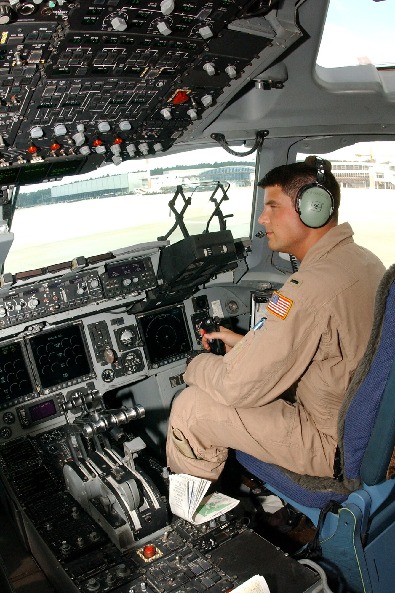 1st Lt. Joe Purcell, 816th Expeditionary Airlift Squadron, C-17 pilot assits on one of the numerous C-17 missions ferrying American citizens from Cyprus to Ramstein.
