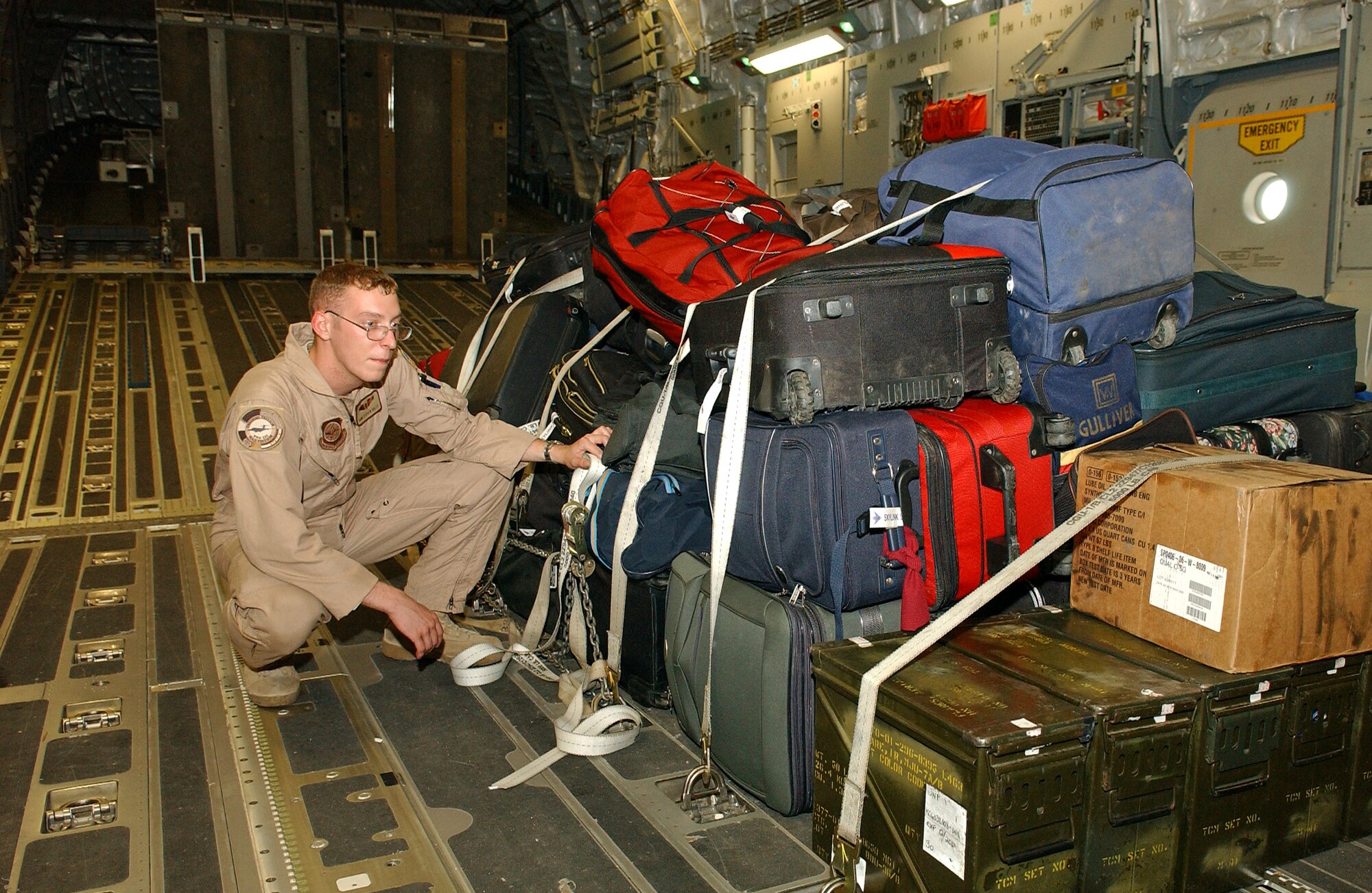 RAMSTEIN AIR BASE, Germany -- Senior Airman Kyle Williams, 816th Expeditionary Airlift Squadron C-17 loadmaster checks luggage while on a mission transporting American citizens who left the escalating conflict in Lebanon. 