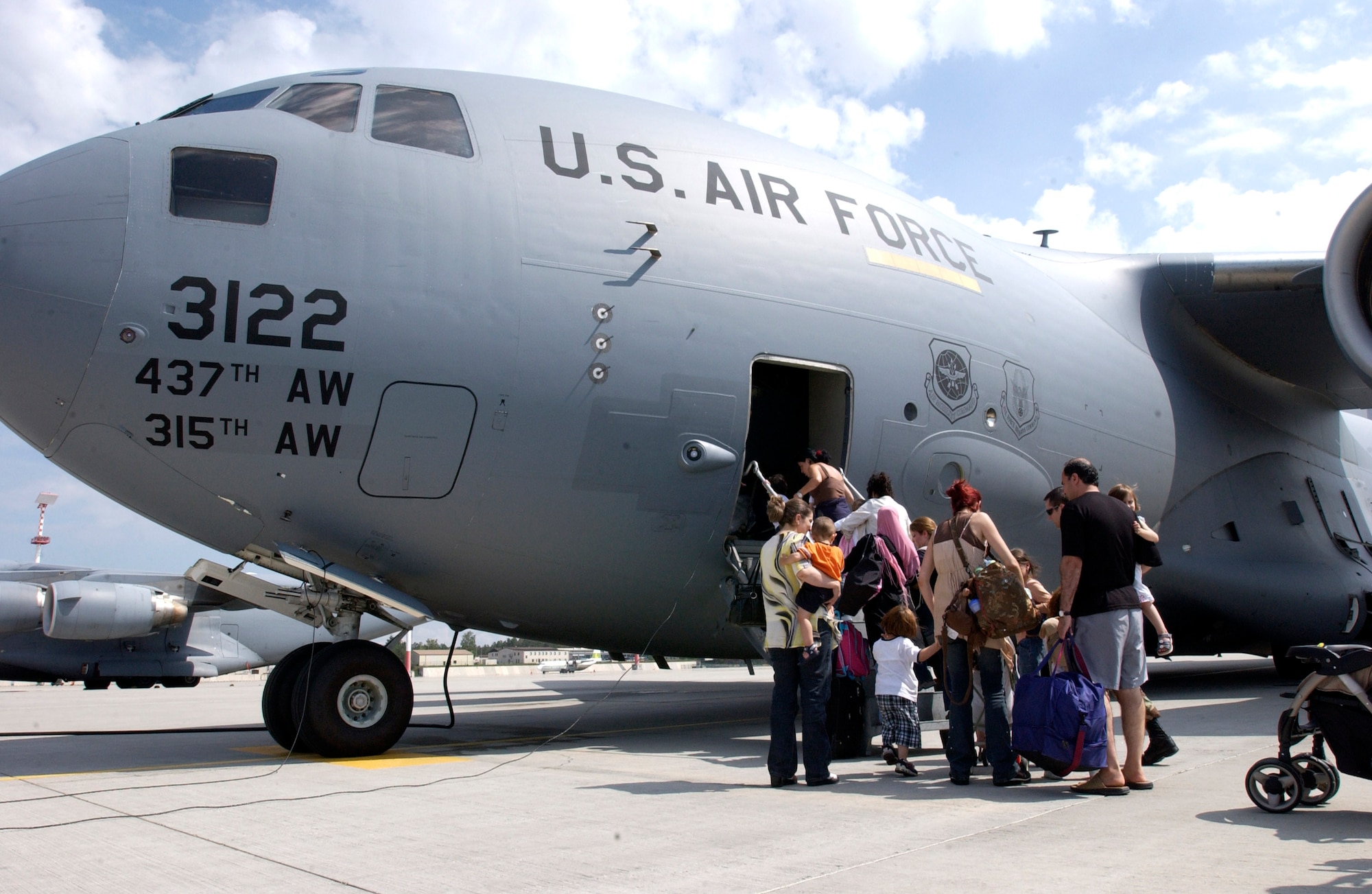 Americans begin boarding a C-17 Globemaster III at Ramstein Air Base, Germany, on July 23. Airmen at Ramstein AB provided humanitarian assistance for American citizens departing the Lebanon crisis on their way to the United States. (U.S. Air Force photo/Staff Sgt. Angela B. Malek)