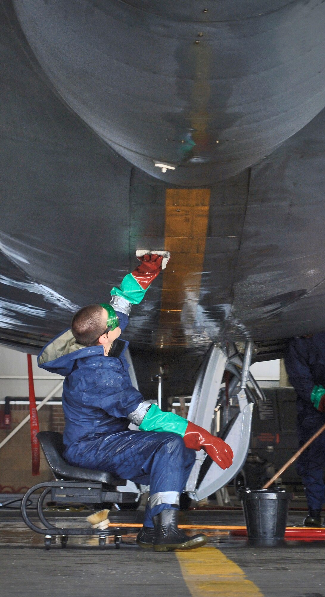 Senior Airman Jeremy Lueth hand-washes the centerline on the underbelly of a KC-135 Stratotanker at Royal Air Force Mildenhall, England, on July 24. The Airman is with the 100th Aircraft Maintenance Squadron. He spends 12 hours a day with a cleaning team that keeps the nearly 50-year-old aircraft corrosion free and looking its best. (U.S. Air Force photo/Master Sgt. Lance Cheung)
