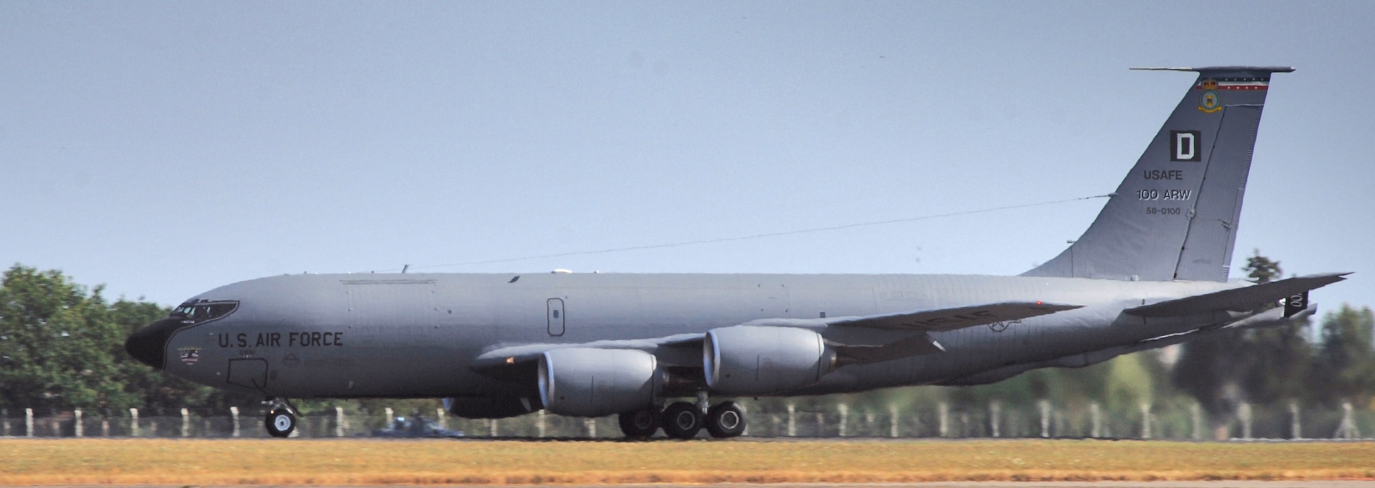 A KC-135 Stratotanker takes off for a mission from Royal Air Force Mildenhall, England, on July 24. Unusually hot weather for this part of England caused a heat wave to distort the lower image of the nearly 50-year-old tanker, just as the heat from the turbofan engines distorts the view of trees behind it. (U.S. Air Force photo/Master Sgt. Lance Cheung)
