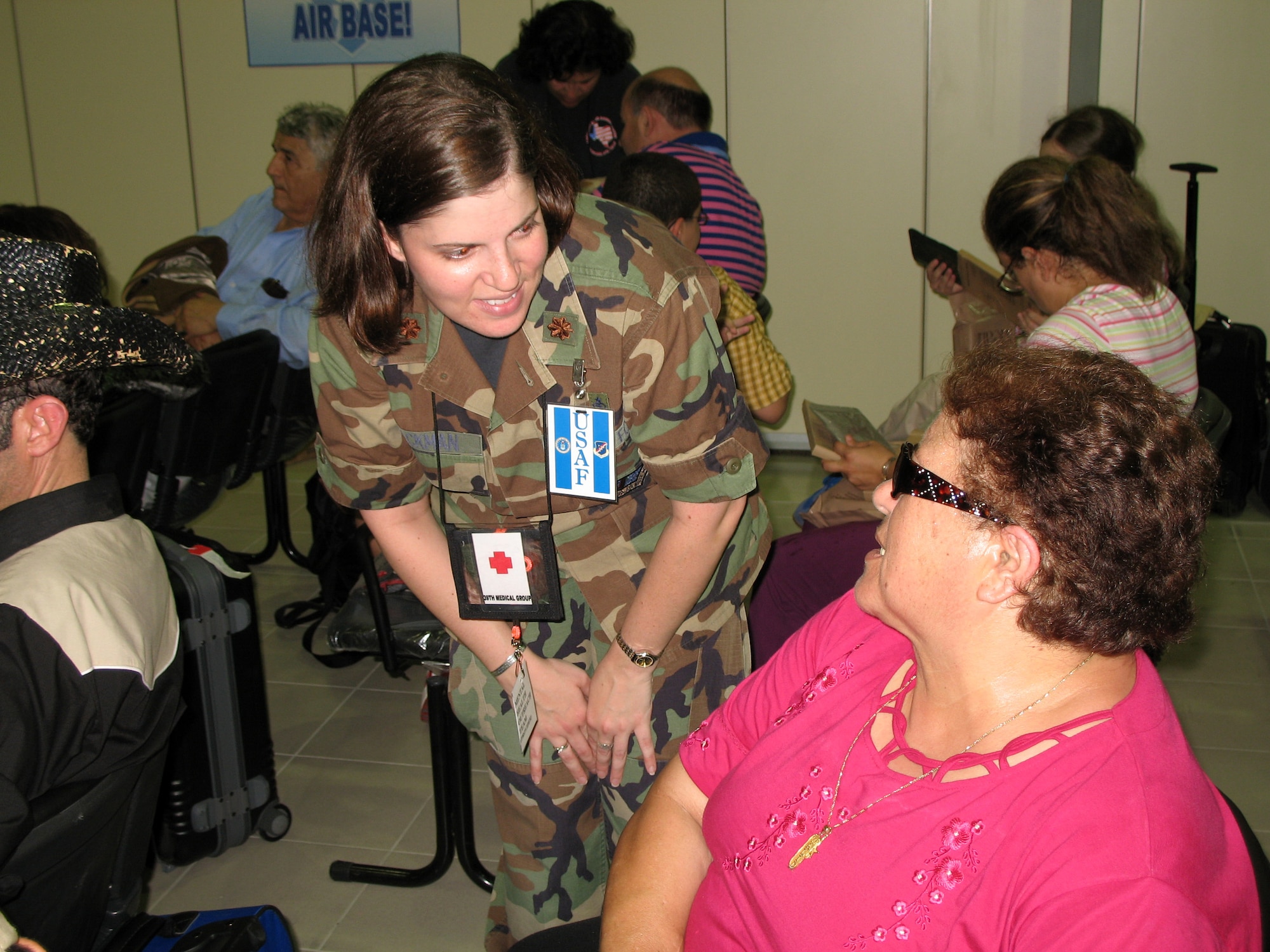 Maj. Lisa Blackman talks with an American citizen who just arrived at Incirlik Air Base, Turkey, July 24th, from Lebanon.  More than 1,600 citizens arrived in the port city of Mersin, Turkey, on the USS Trenton before being transported by bus to Incirlik.  Major Blackman is with the 39th Medical Squadron's life skills support center.  (U.S. Air Force photo/Master Sgt. Bob Herron) 