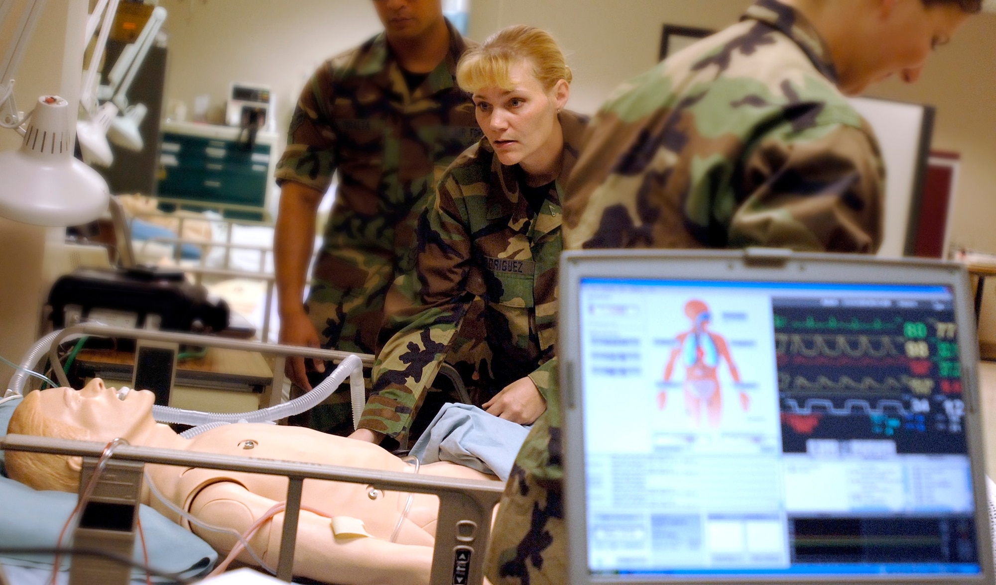 Senior Airman Jamie Rodriguez diagnoses a simulated patient during technical training on Friday, July 21, at Sheppard Air Force Base, Texas. The simulated patient is one of seven new advanced medical tools used to help Air Force medical technical training students receive realistic instruction. (U.S. Air Force photo/Tech. Sgt. Cecilio Ricardo Jr.)