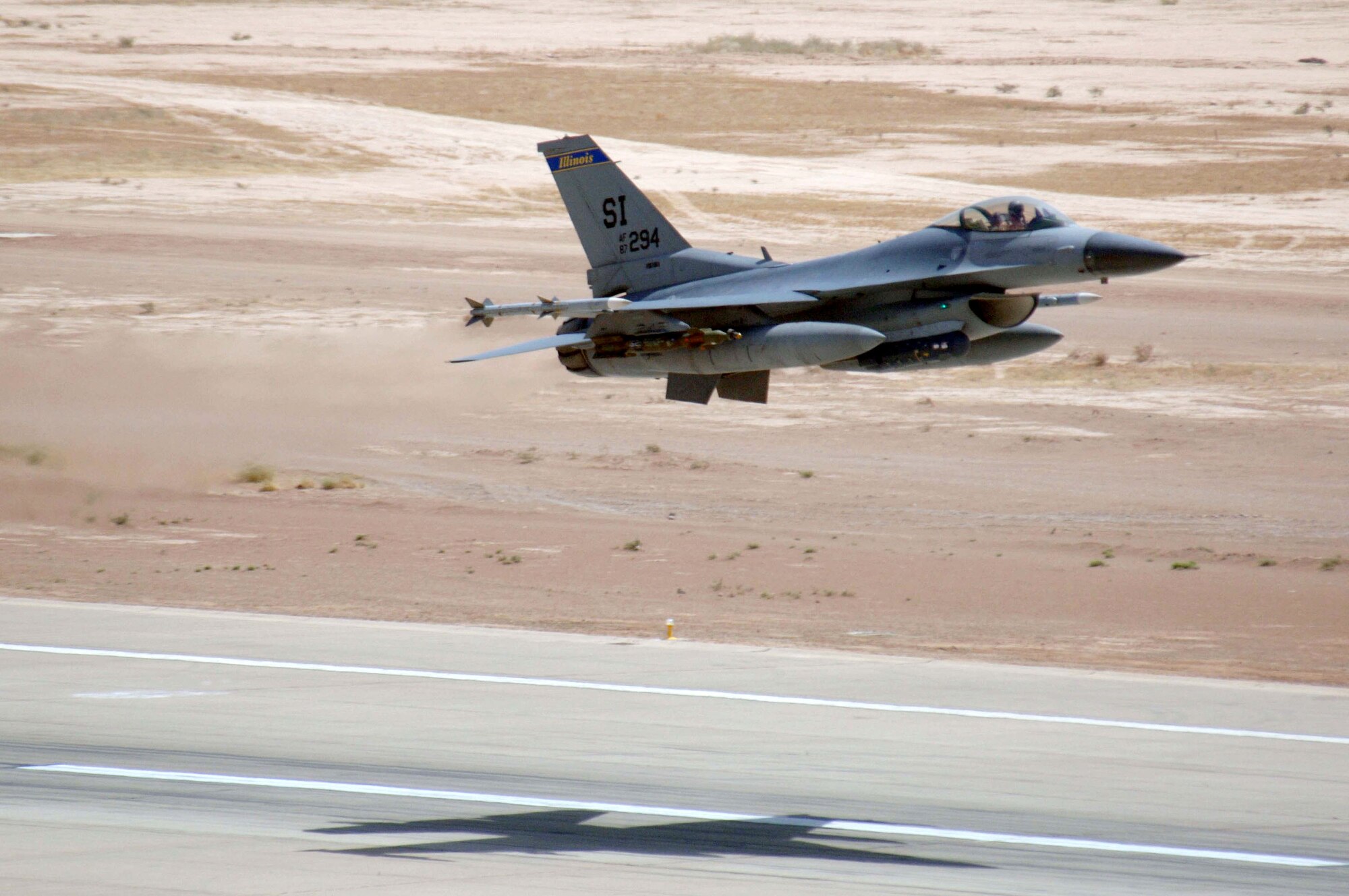 An F-16 Fighting Falcon assigned to the 332nd Expeditionary Fighter Squadron at Balad Air Base, Iraq, takes off on an Operation Iraqi Freedom mission Friday, July 21. The F-16 jet is deployed from the 183rd Fighter Wing at Springfield Air National Guard, Ill., and provides close-air support and "eyes in the skies" intelligence, surveillance and reconnaissance for ground forces during combat operations. (U.S. Air Force photo/Staff Sgt. Tony R. Tolley) 