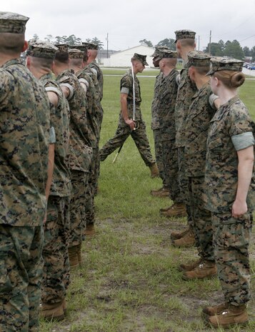 MARINE CORPS BASE CAMP GEIGER, N.C.?Cpl. Paul Rodriguez, a 20-year-old data network specialist for the 2nd Marine Logistics Group, II Marine Expeditionary Force, and native of Glen Flora, Texas, checks his drill card before calling his next command during his final close-order drill evaluation at the School of Infantry?s Corporal?s Course. The three-week course is designed to sharpen the skills of new Marine Corps noncommissioned officers in leadership, physical fitness and military knowledge.