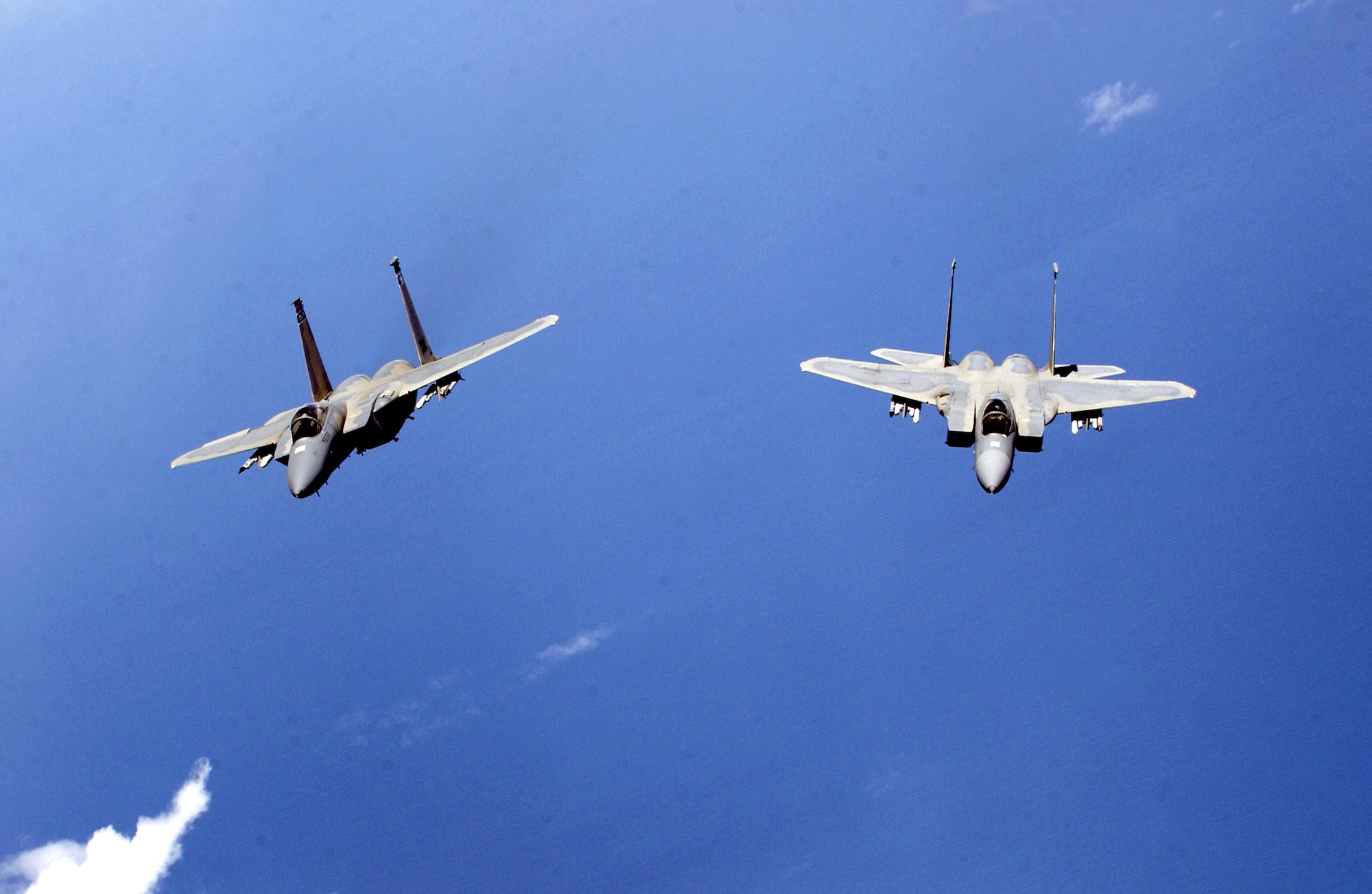 F-15 Eagles from the Air National Guard's 125th Fighter Wing fly near Jacksonville International Airport, Fla., on July 20. The F-15s and KC-135 Stratotankers from the 434th Air Refueling Wing were training in mid-air refueling. (Air National Guard photo/Master Sgt. Shaun Withers) 
