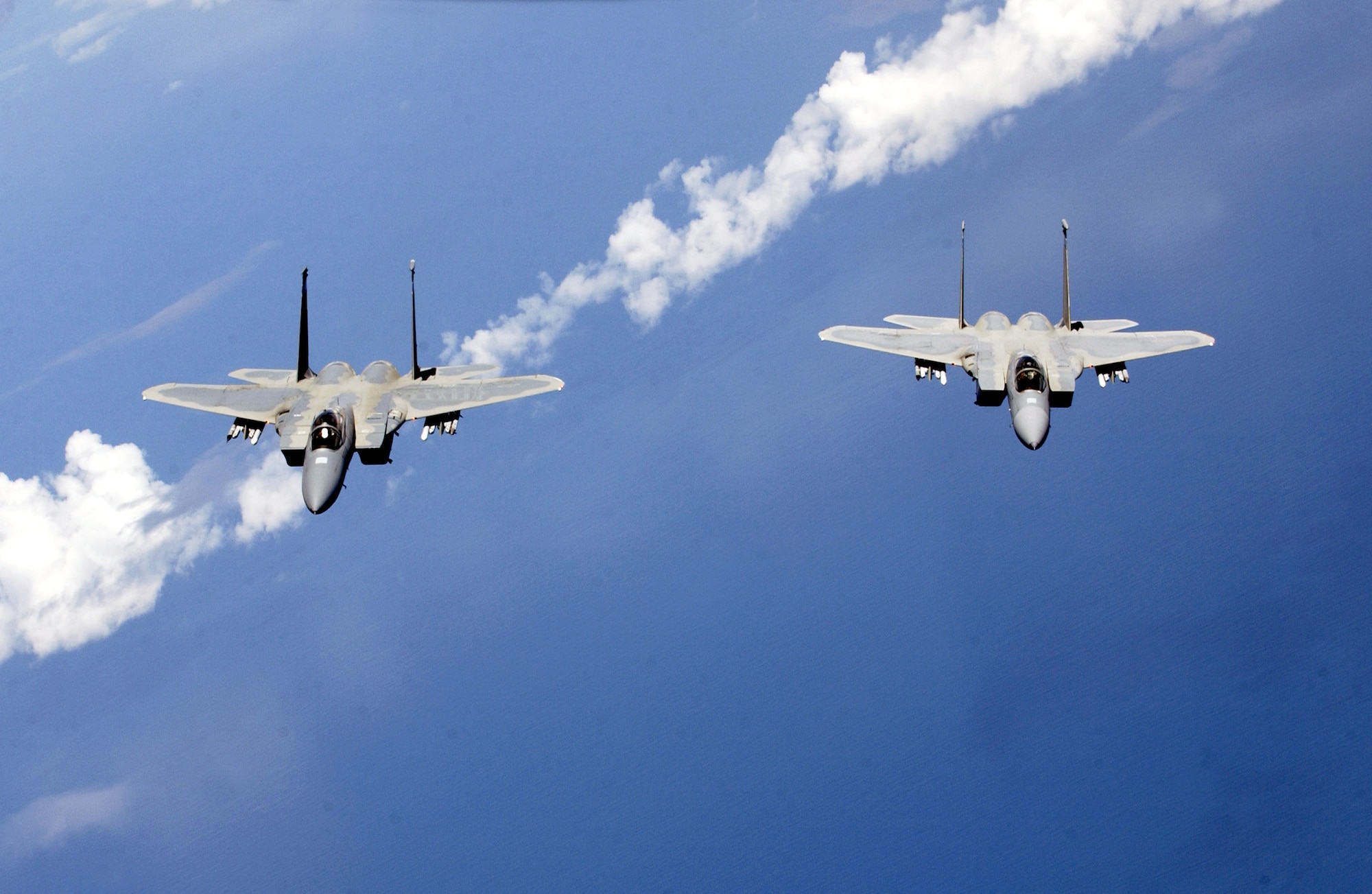F-15 Eagles from the Air National Guard's 125th Fighter Wing fly near Jacksonville International Airport, Fla., on July 20. The F-15s and KC-135 Stratotankers from the 434th Air Refueling Wing were training in mid-air refueling. (Air National Guard photo/Master Sgt. Shaun Withers) 

