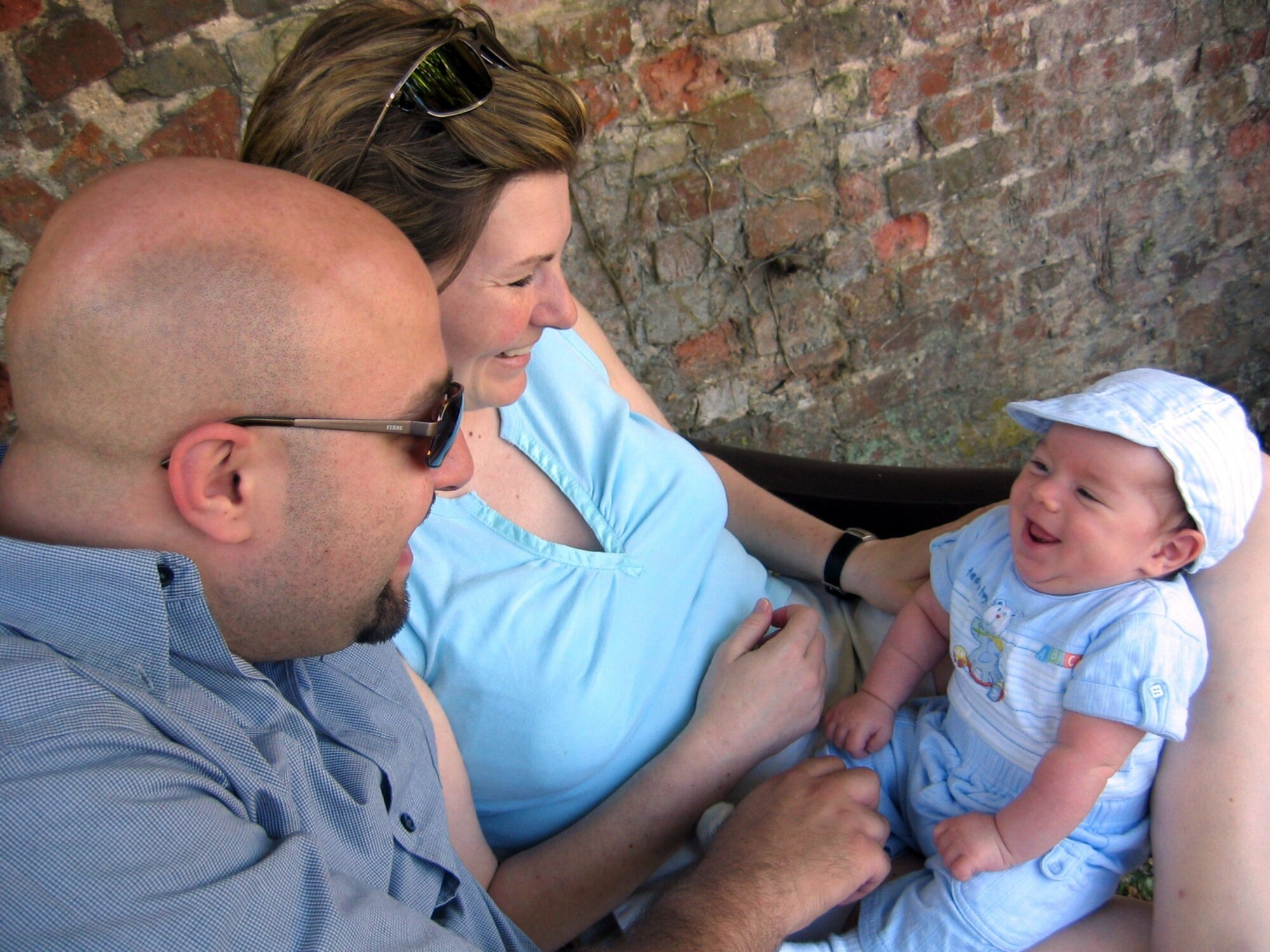 NEWMARKET, England – Capt. Jennifer Tay, an audiologist at RAF Lakenheath’s 48th Medical Support Squadron, and her husband, Talal Tay, smile with relief at their baby son, Abram. The family arrived home safely after being stranded in Beirut for two weeks during the Israeli-Lebanon crisis. The Tays were evacuated by boat to Cyprus Sunday before making their way back to the UK Monday night.  