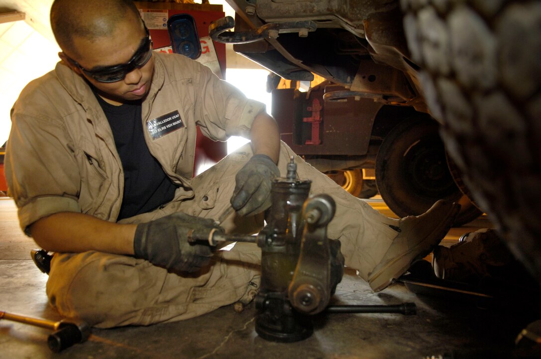 Senior Airman Jason Valledor performs maintenance on a vehicle at Balad Air Base, Iraq, on July 21. Airman Valledor is a vehicle mechanic assigned to the 332nd Expeditionary Logistics Readiness Squadron and is deployed from Ramstein AB, Germany. (U.S. Air Force photo/Airman 1st Class Andrew Oquendo)