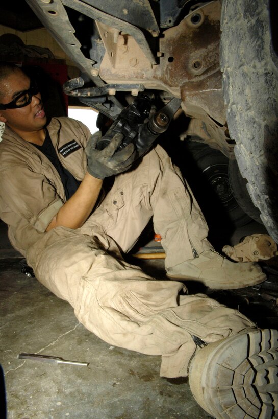Senior Airman Jason Valledor performs maintenance on a vehicle at Balad Air Base, Iraq, on July 21. Airman Valledor is a vehicle mechanic assigned to the 332nd Expeditionary Logistics Readiness Squadron and is deployed from Ramstein AB, Germany. (U.S. Air Force photo/Airman 1st Class Andrew Oquendo)