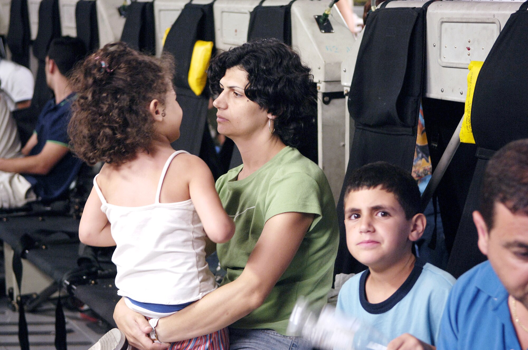 An American citizen from Lebanon waits to depart a C-17 Globemaster III on Monday, July 24, at McGuire Air Force Base, N.J. McGuire is providing humanitarian assistance for American citizens who are leaving Lebanon to return home after more than a week of fighting between the Israeli military and the militant group Hezbollah. More than an expected 1,000 Americans began arriving at McGuire on July 23. (U.S. Air Force photo/Denise Gould)