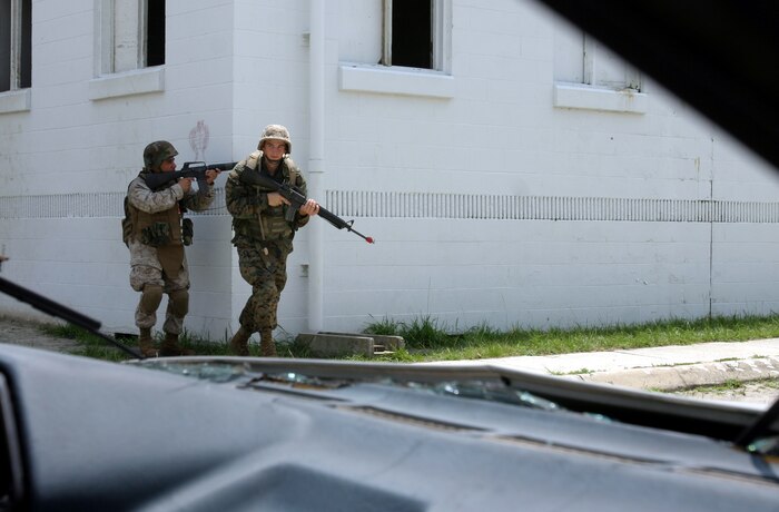 MARINE CORPS BASE CAMP LEJEUNE, N.C. (July 26, 2006) ? Marines use the leap frog method to move from cover to cover in an urban training environment here July 26. Marines with Combat Logistics Regiment 27, 2nd Marine Logistics Group learned how to patrol, enter buildings, clear rooms and maintain themselves in an urban environment during a Basic Urban Combat Training course here, July 24 through 28.