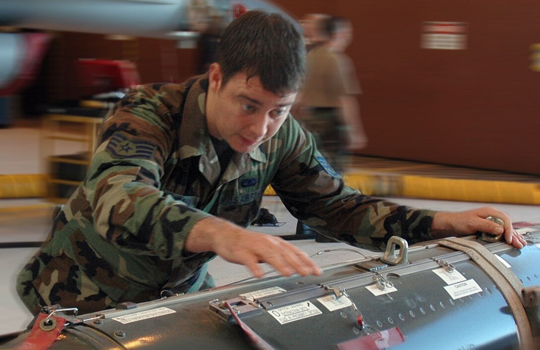 Staff Sgt. Matthew Cariveau, 944th Aircraft Maintenance Squadron weapons technician, does quality checks and inspections on bombs prior to them being loaded on an F-16. In his civilian job, Sergeant Cariveau is a Sous Chef at the Point Hilton in Phoenix and was recently featured on Channel 3 news for a Fourth of July cooking segment. (U.S. Air Force photo/Tech. Sgt. Barbara Plante)