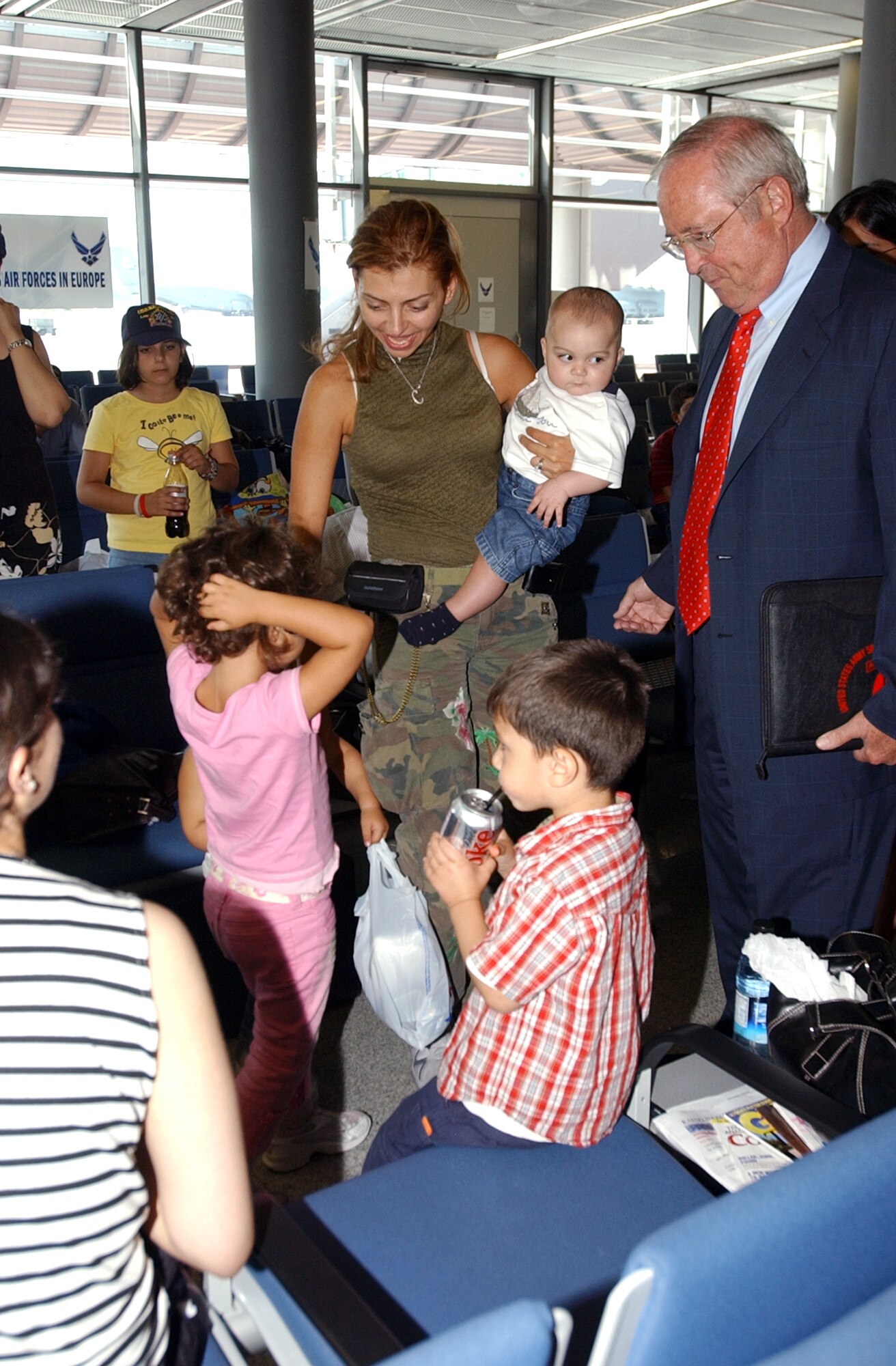 The Honorable William R. Timken, Jr., U.S. Ambassador to Germany, speaks with displaced Americans at the passenger terminal at Ramstein Air Base, Germany, on July 25. Ramstein Airmen provided humanitarian assistance for American citizens departing the Lebanon crisis on their way to the United States. (U.S. Air Force photo/Airman Amber Sorsek-Bressler) 


