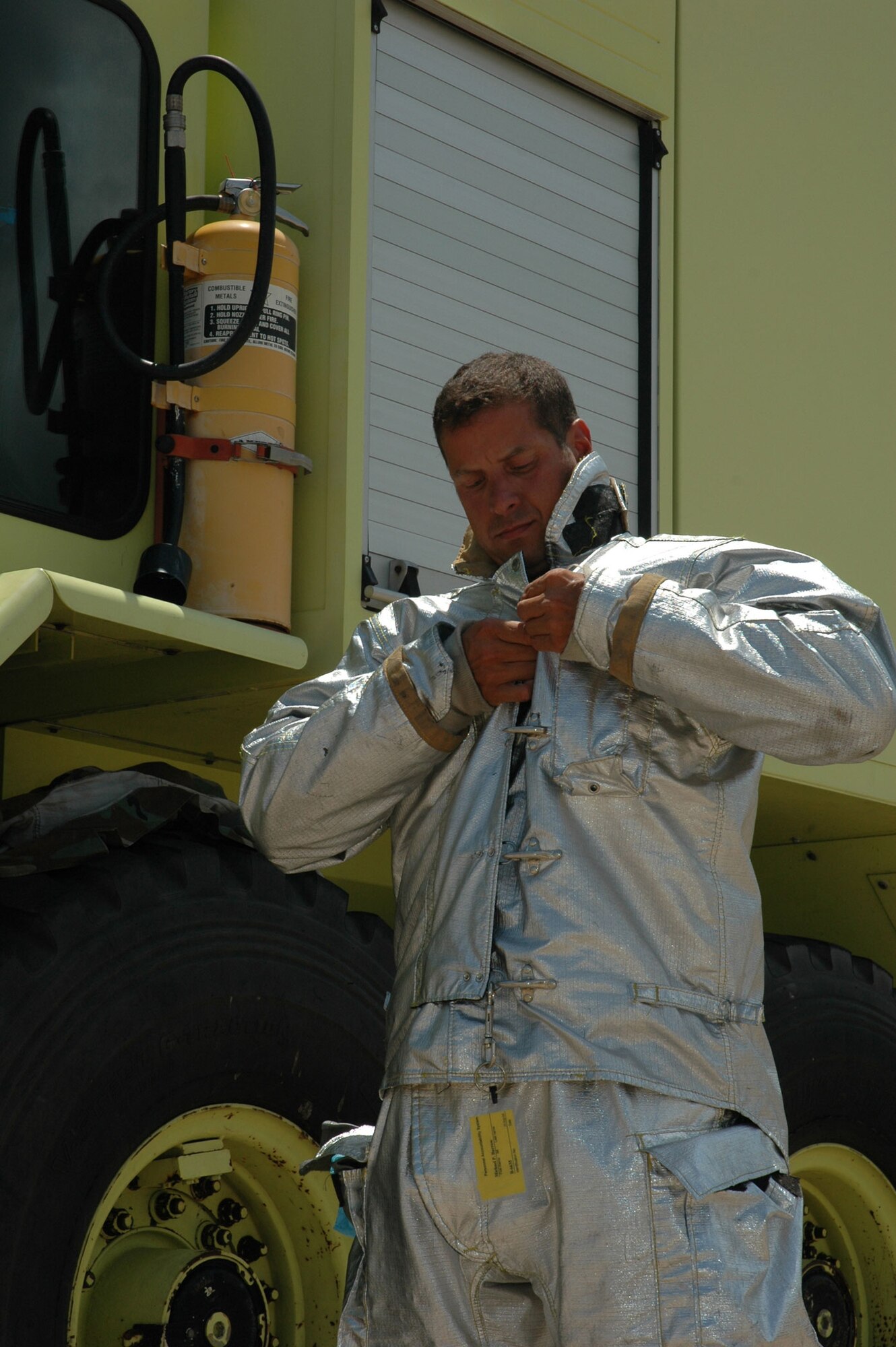 Staff Sgt. Michael P. Barrow dons his personal protective equipment July 5 at the Duke Field fire station. He is Air Force Reserve Command's 2005 Military Firefighter of the Year. An award's presentation ceremony is scheduled for Sept. 12 in Dallas (U.S. Air Force photo/Senior Airman Erik Hofmeyer) 