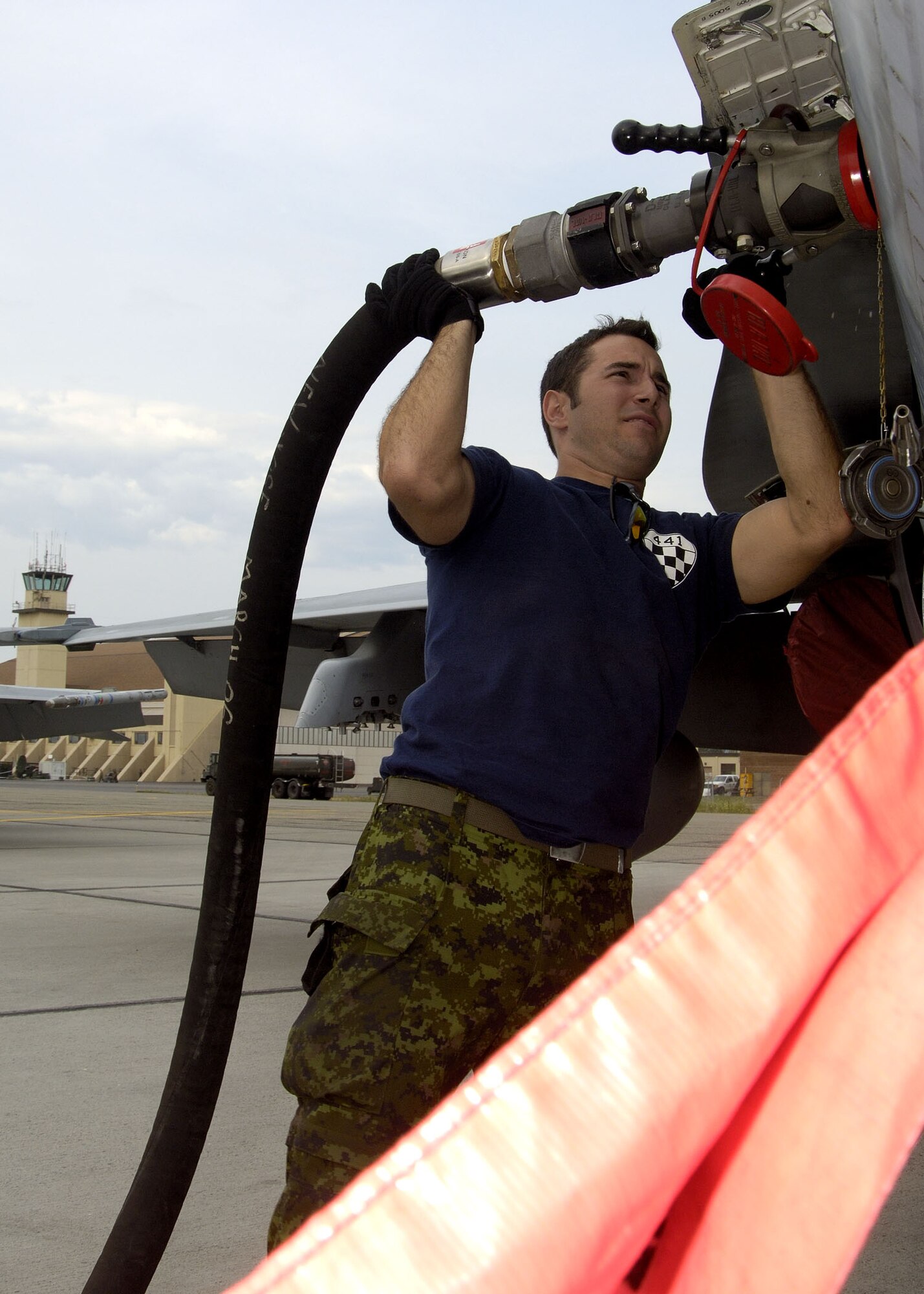 EIELSON AIR FORCE BASE, Alaska - Corporal (Cpl) Cedric Boivin, an Aviation Technician at 409 Tactical Fighter Squadron disconnects a JP8 fuel hose from a  CF-18. Cpl Boivin, a native of Chicutimi, Qc. is a participant in Excersise Co-operative Cope Thunder 06-3 (CCT06-3). CCT06-3 is an annually run excersise with missions being flown out of both Eielson and Elmendorf Air Force Base (AFB), Alaska from Jul 20 - Aug 5 2006. Excersise participants this year include Canada the United States, Japan, Sweden, Nato, Mongolia, South Korea, Germany, the Slovak Republic, and Australia. Observer nations include Mexico, Bangladesh, Sri Lanka Malaysia, and Russia. Approximately 1300 service personnel are participating, about 800 of those from the host nation. Photo by Cpl J.A. Wilson, CCT06-3 Canadian Public Affairs
