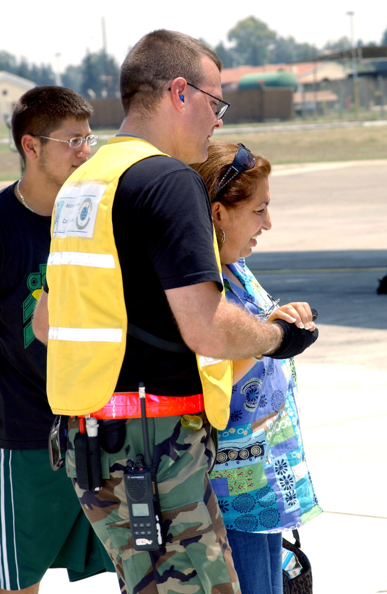 Tech. Sgt. Kevin Drake assists American citizens as they prepare to leave Incirlik Air Base ,Turkey, on July 25. The Americans had stopped at Incirlik on their way to the United States. Sergeant Drake is with the 728th Air Mobility Squadron. (U.S. Air Force photo/Airman 1st Class Nathan W. Lipscomb)