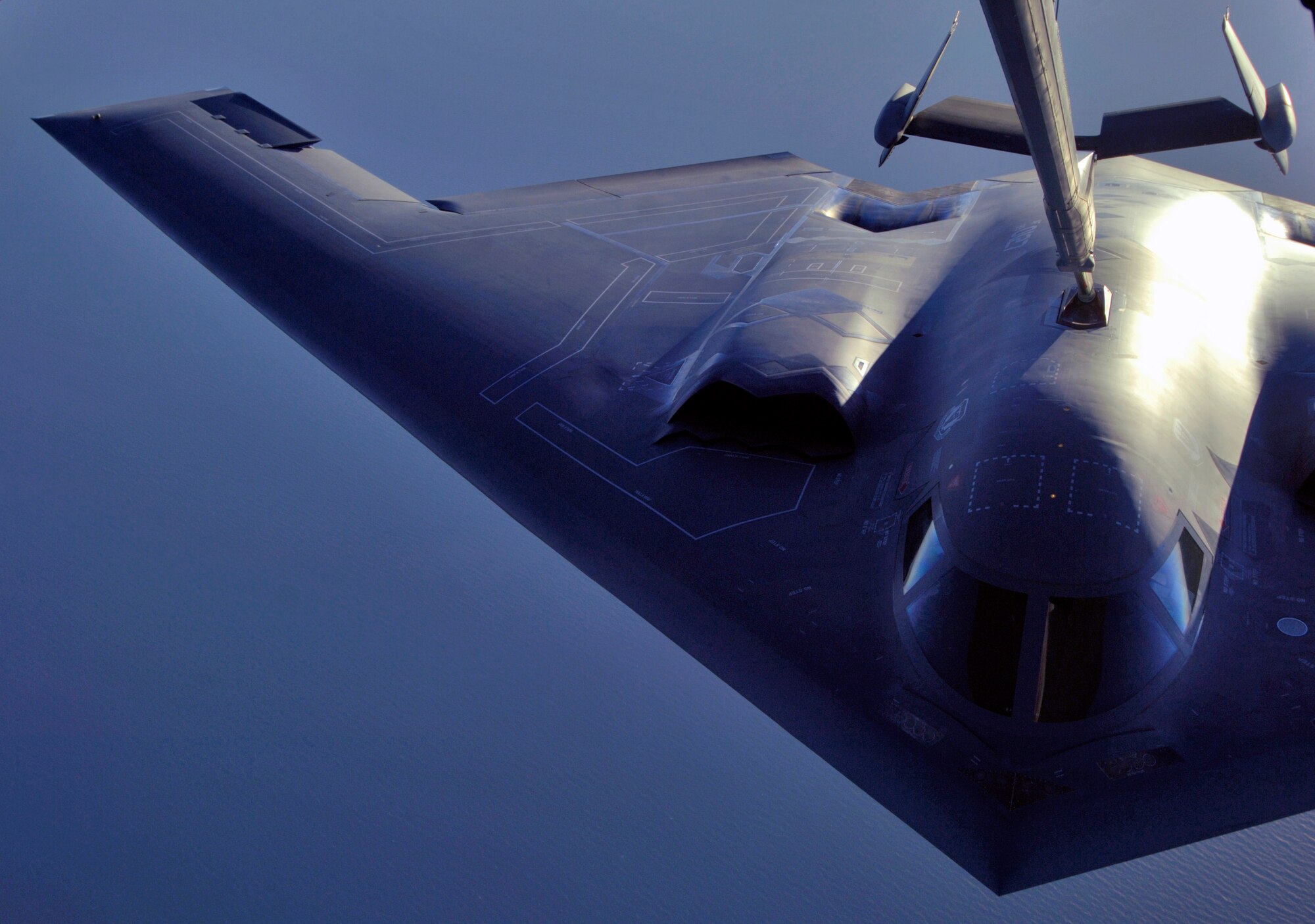 A B-2 Spirit is refueled by a KC-10 Extender over Australia during exercise Green Lightning on Tuesday, July 25. The KC-10 and B-2 are from the 36th Expeditionary Wing at Guam. The exercise will test U.S. capabilities and provide operational familiarity in the region for the Pacific bomber presence as well as serve to enhance relations with the Australians. (U.S. Air Force photo/ Tech. Sgt. Shane A. Cuomo) 
