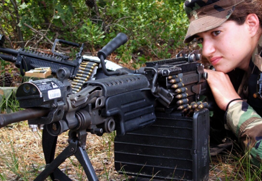 U.S. Air Force Airman 1st Class Renee Verdecchio, from McGuire Air Force Base, N.J., watches over a perimeter area during exercise Eagle Flag 06-3 at Naval Air Engineering Station Lakehurst, N.J., July 15, 2006. 