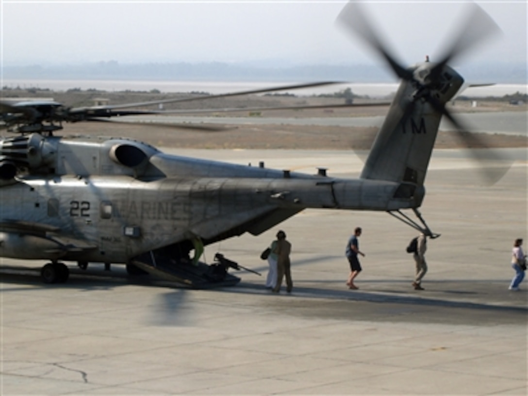 U.S. citizens exit a U.S. Marine Corps CH-53 helicopter in Cyprus following their transportation from the U.S. Embassy in Beirut, Lebanon, July 16, 2006. At the request of the U.S. Ambassador to Lebanon and at the direction of the Secretary of Defense, the United States Central Command and U.S. Marines are assisting with the authorized departure of U.S. citizens from Lebanon. 