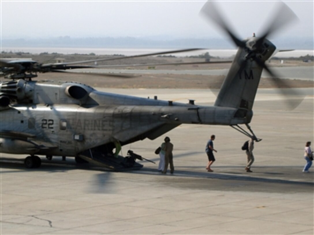 U.S. citizens exit a U.S. Marine Corps CH-53 helicopter in Cyprus following their transportation from the U.S. Embassy in Beirut, Lebanon, July 16, 2006. At the request of the U.S. Ambassador to Lebanon and at the direction of the Secretary of Defense, the United States Central Command and U.S. Marines are assisting with the authorized departure of U.S. citizens from Lebanon. 