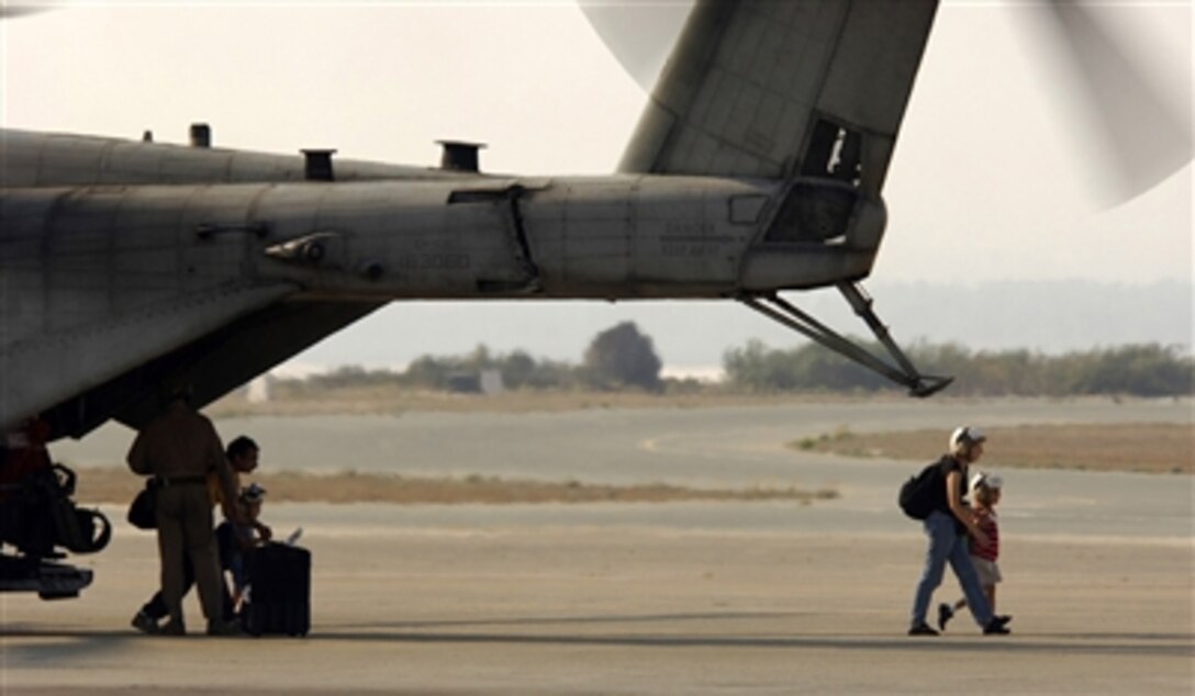 U.S. citizens exit a U.S. Marine Corps helicopter at Cyprus following their flight from the U.S. Embassy in Beirut, Lebanon, July 17, 2006.