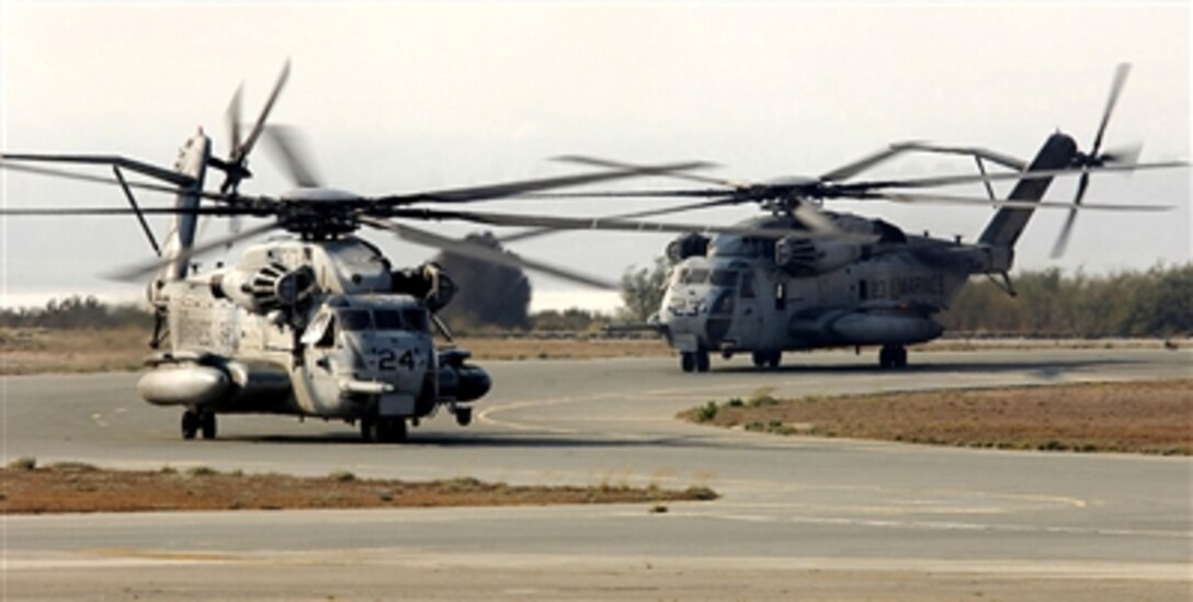 Two U.S. Marine Corps CH-53 Super Stallion helicopters taxi to the parking ramp at Cyprus following their flight from the U.S. Embassy in Beirut, Lebanon, on July 16, 2006. 