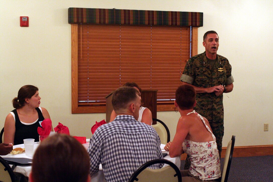 Col. Gregg A. Sturdevant, Commanding Officer, 26th MEU, speaks to MEU spouses about the training cycle the MEU is conducting and the upcoming deployment in support of the Global War on Terrorism, during the "Meet the Spouses Night," here, July 27, 2006.