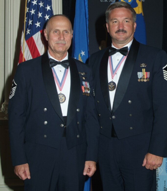Master Sgts. Terry Dawkins (left), 919th Maintenance Operations Flight, and Joe Webber, 919th Communications Squadron, pose for photos after graduating from the First Sergeant Academy at Maxwell/Gunter Air Force Base, Ala., April 28.