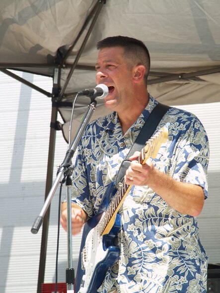 Maj. David Booher, 919th Aircraft Maintenance Squadron commander, sang one song after another as the "wing band" played on July 14 at the Pine Tree Lounge to celebrate completion of the Operational Readiness Inspection.