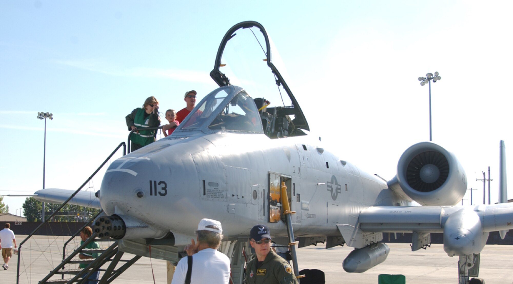 Lt. Col. Sandy Chandler, 319th Safety Office, shows Carter Rix and Tech. Sgt. Sean Rix, 906th Air Refueling Squadron, the cockpit of an A-10 Thunderbolt. 