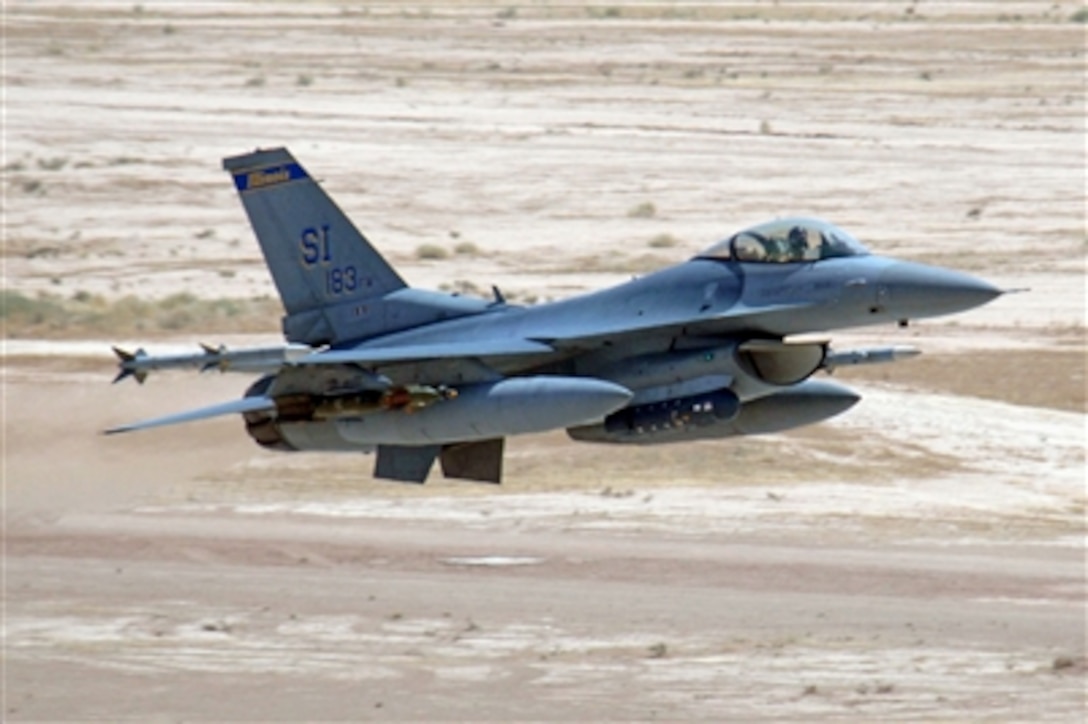 An F-16 Fighting Falcon aircraft assigned to 332nd Expeditionary Fighting Squadron takes off from the flight line at Balad Air Base, Iraq, on July 21, 2006. 