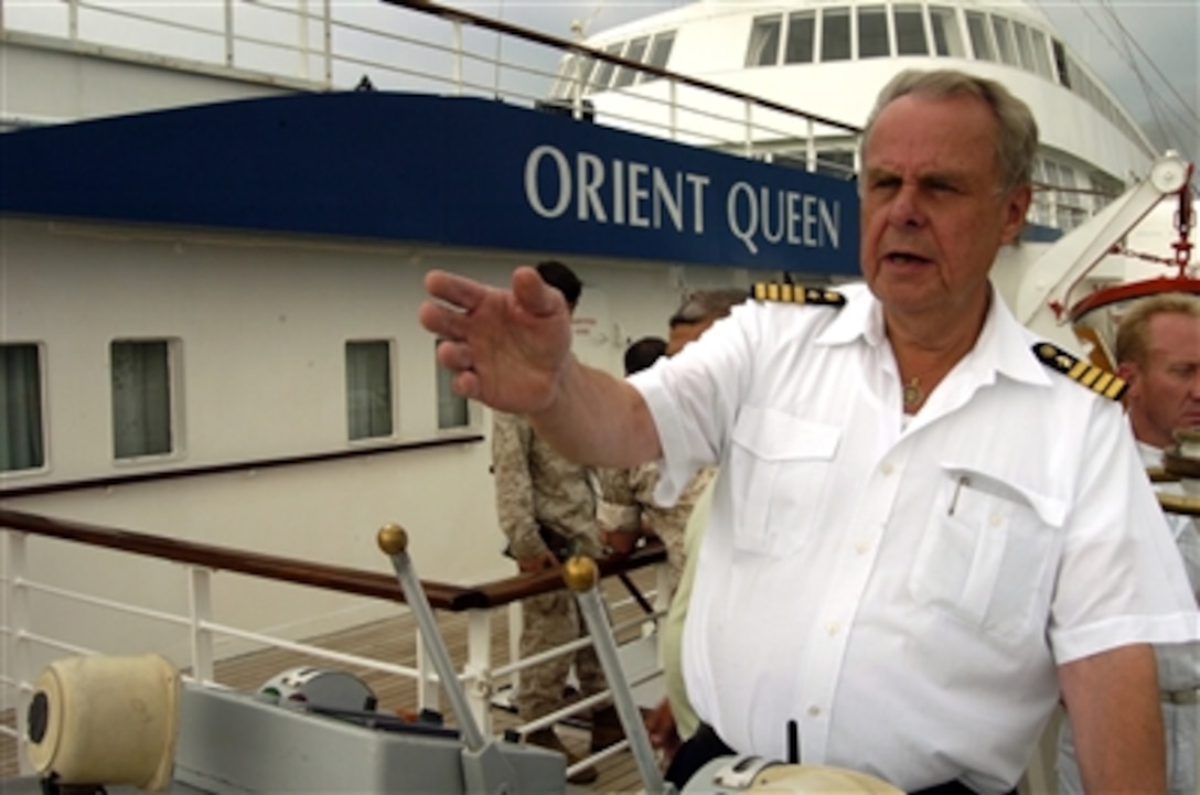 Capt. Christoph Felsenstein of the cruise ship Orient Queen pilots his ship into the port of Beirut, Lebanon, to pick up more than 1,000 American citizens and bring them to safety in Cyprus on July 20, 2006. The ship, under contract with the U.S. government, is part of the larger U.S. military mission to assist U.S. citizens in their departure from Lebanon. At the request of the U.S. Ambassador to Lebanon and at the direction of the Secretary of Defense, the United States Central Command and elements of Task Force 59 are assisting with the departure of U.S. citizens from Lebanon.