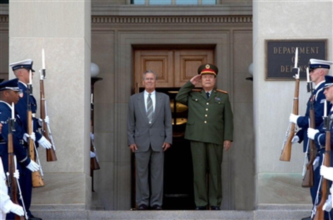 Secretary of Defense Donald H. Rumsfeld and Vice Chairman of the People's Republic of China Central Military Commission Gen. Guo Boxiong listen to China's national anthem during welcoming ceremonies at the Pentagon on July 18, 2006. Rumsfeld and Guo Boxiong, who is the vice chairman of the People's Republic of China Central Military Commission, will meet to discuss regional and international defense issues of mutual interest. 