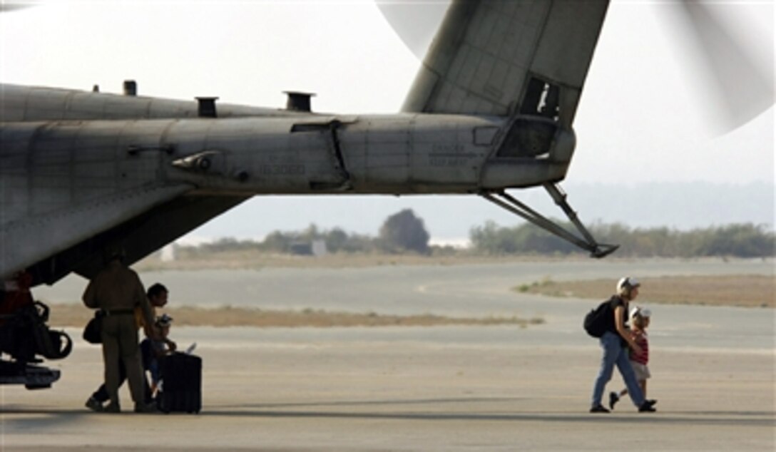 U.S. citizens exit a U.S. Marine Corps CH-53 Super Stallion helicopter at Royal Air Force Base Akrotiri in Cyprus following their flight from the U.S. Embassy in Beirut, Lebanon, on July 17, 2006. At the request of the U.S. Ambassador to Lebanon and at the direction of the Secretary of Defense, the United States Central Command and 24th Marine Expeditionary Unit are assisting with the departure of U.S. citizens from Lebanon. The helicopters are attached to Marine Medium Helicopter Squadron 365.