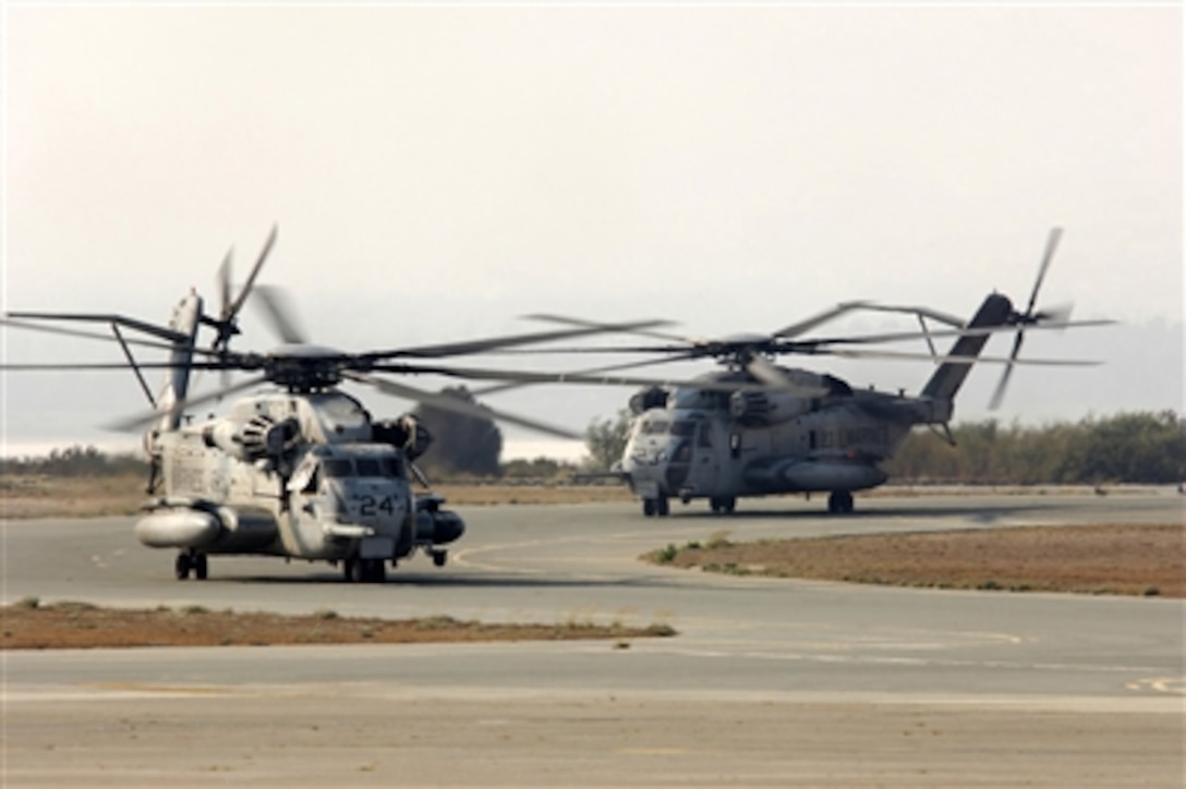 Two U.S. Marine Corps CH-53 Super Stallion helicopters taxi to the parking ramp at Royal Air Force Base Akrotiri in Cyprus following their flight from the U.S. Embassy in Beirut, Lebanon, on July 16, 2006. At the request of the U.S. Ambassador to Lebanon and at the direction of the Secretary of Defense, the United States Central Command and 24th Marine Expeditionary Unit are assisting with the departure of U.S. citizens from Lebanon. The helicopters are attached to Marine Medium Helicopter Squadron 365. 