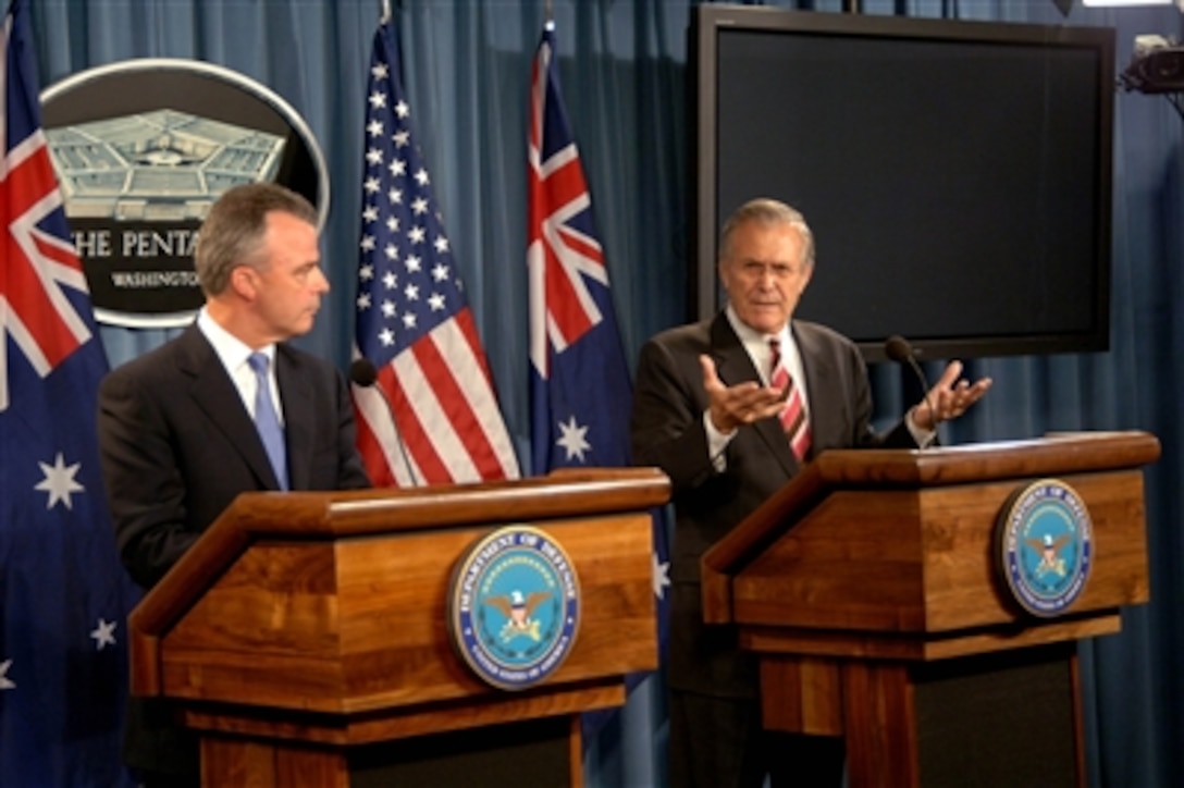 Secretary of Defense Donald H. Rumsfeld (right) and Australian Minister of Defense Brendan Nelson answer questions from the media during a joint press conference in the Pentagon in Arlington, Va., on June 28, 2006.  Rumsfeld, Nelson and their senior advisors met earlier to discuss regional and international defense issues.  
