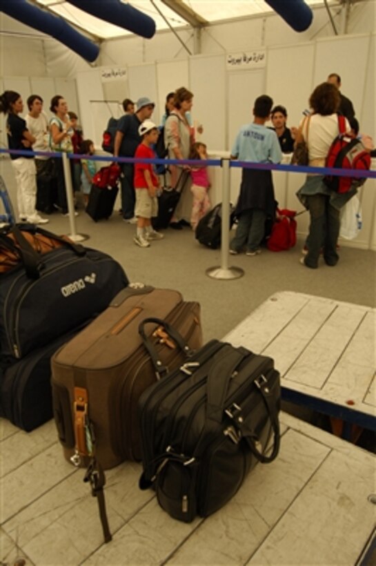 U.S. citizens clear immigration in Beirut, Lebanon, before being transported to Cyprus aboard the cruise ship Orient Queen on July 19, 2006. The ship, under contract with the U.S. government, is part of the larger U.S. military mission to assist U.S. citizens in their departure from Lebanon. 