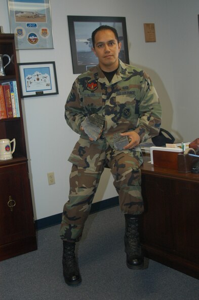 Captain Rafael Alicea, 7th OSS airfield operations director holds, pieces of the runway that were recovered by airfield management operations personnel during one of their daily foreign object debris checks.                                