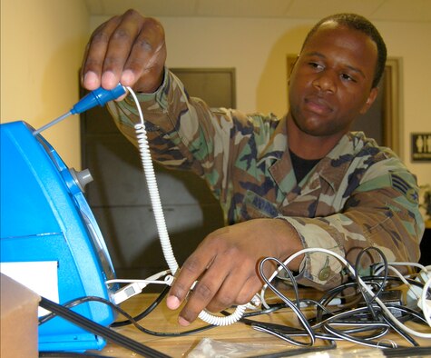 Senior Airman Emanuel Rodrigues, 436th Medical Support Squadron biomedical equipment journeyman at Dover Air Force Base, Del., performs a functional check and verifies the calibration on a blood pressure machine. Airman Rodrigues is responsible to ensure medical equipment is serviceable and safe prior to customers receiving care. (U.S. Air Force photo/Tech. Sgt. Melissa Phillips)