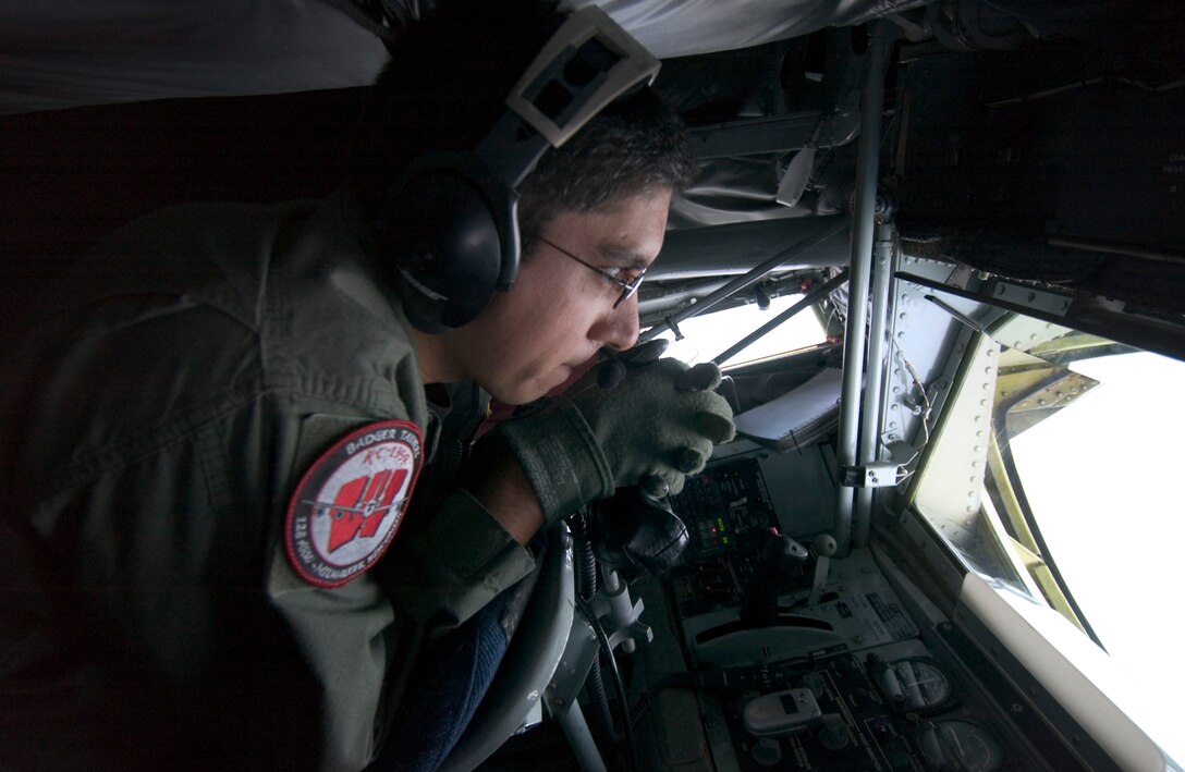 TSgt Paul Mathews a Boom operator from the 128th ARW, Wisconsin Air National Guard waits for fighter aircraft in need of fuel. This is one of TSgt Mathews last flights as a boom operator. He will soon enter pilot training. The 128th is participating in Cooperative Cope Thunder 06-03 held at Eielson AFB, Alaska.  The multi-national exercise is being held from 20 July thru 5 August, 2006.  USAF Photo By: SMSgt Jeff Rohloff