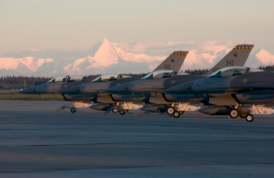 F-16 fighter aircaft from the Air Force Reserve Command unit 419th Fighter Wing, stand ready against the back drop of Mt McKinley, Alaska. Wing Operations Personel recently participated in a multi-national exercise at Eilson AFB. (U.S. Air Force Photo/Senior Master Sgt. Jeff Rohloff)